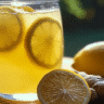 Close-up of the 3 ingredient brazilian mounjaro sparkling ginger lemon drink with a lemon slice floating on top.