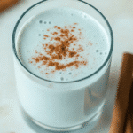 Does the Blue Salt Trick Really Work? The Truth About This Viral Stamina Boost 5 Glass of Blue Salt Trick Drink topped with cinnamon powder, surrounded by cinnamon sticks on a marble background.