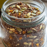 Glass jar filled with a colorful mix of bariatric seeds, including chia, flax, pumpkin, and sunflower.