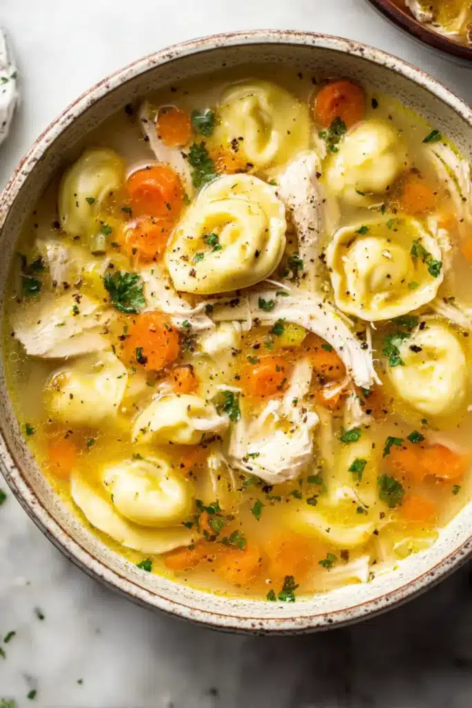 This Chicken Tortellini Soup brings together tender shredded chicken, plump cheese tortellini, and fresh vegetables simmered in a flavorful golden broth — the ultimate bowl of comfort.