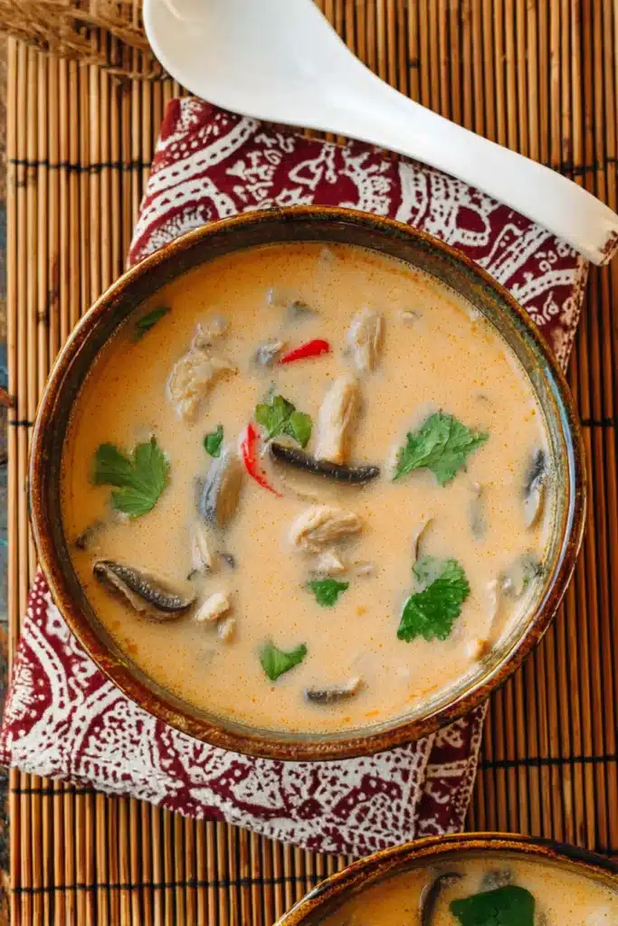 Slow Cooker Thai Chicken Coconut Soup 6 A comforting bowl of slow-cooked Tom Kha Soup — rich coconut milk broth infused with lemongrass, galangal, and lime leaves for the perfect Thai-inspired comfort meal.