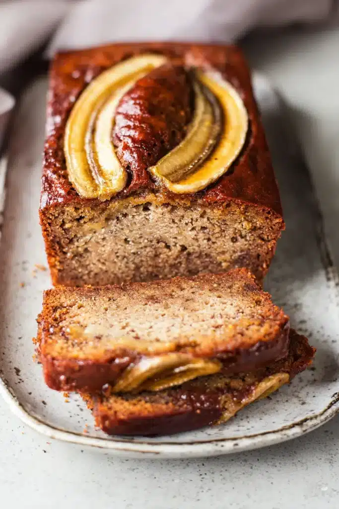 Eggless Banana Bread: Moist, Fluffy, and Foolproof 6 This Eggless Banana Bread is moist, rich, and full of banana flavor — beautifully baked with golden caramelized banana slices on top for a bakery-style finish.
