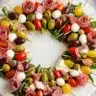 This Christmas Antipasto Wreath is a stunning holiday appetizer made with colorful meats, cheeses, and seasonal garnishes for a festive and delicious presentation.
