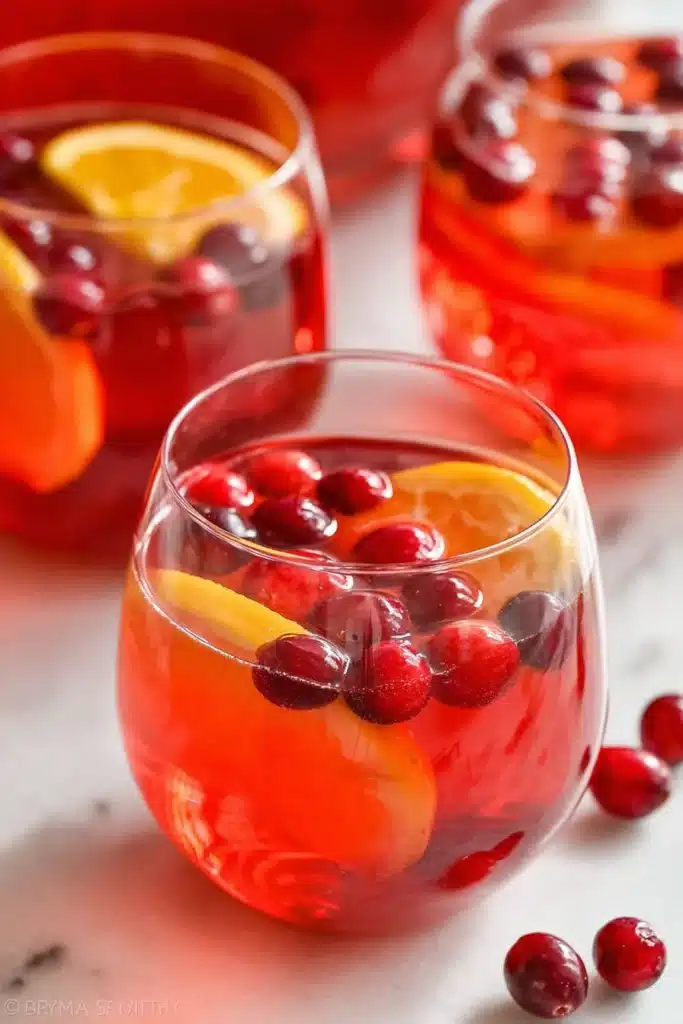 A refreshing holiday Christmas Punch made with cranberries and oranges — perfect for parties and family gatherings.