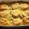 This Biscuits and Gravy Breakfast Casserole combines flaky golden biscuits, creamy sausage gravy, fluffy eggs, and melted cheese for the ultimate comfort breakfast.
