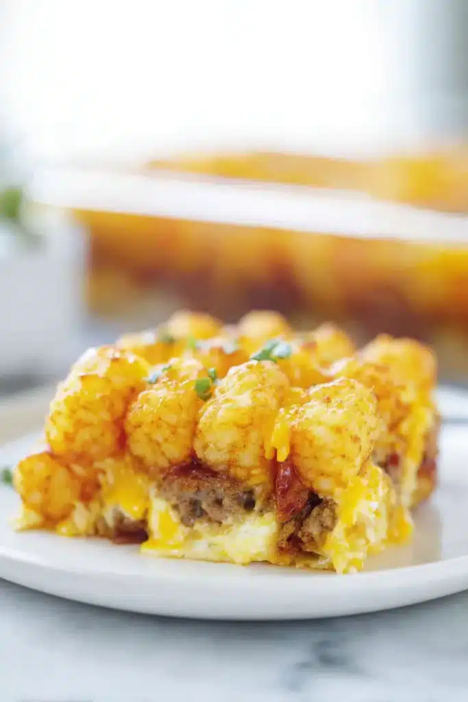 A cozy breakfast classic — this Tater Tot Breakfast Casserole is packed with crispy tater tots, savory sausage, eggs, and melted cheese, baked to golden perfection.