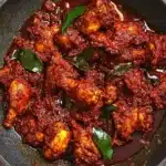 Spicy, aromatic Chicken Ghee Roast cooked in rich ghee and roasted masala for a bold, flavorful Indian dish.