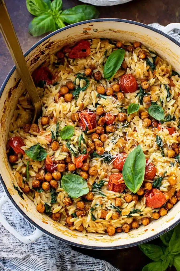 Orzo Dinner Recipe A Clean Eating Meal Perfect for Lazy Nights 7 A hearty orzo dinner tossed with roasted tomatoes, spinach, chickpeas, and fresh basil for a simple but flavor-packed weeknight meal.