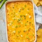 A warm and ultra-cheesy Texas Trash Dip loaded with beans, spices, and melty cheese — perfect for dipping with tortilla chips.